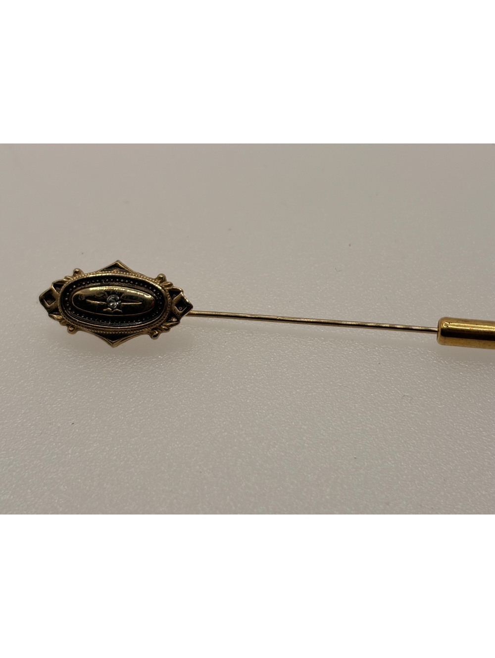 Black oval stick pin